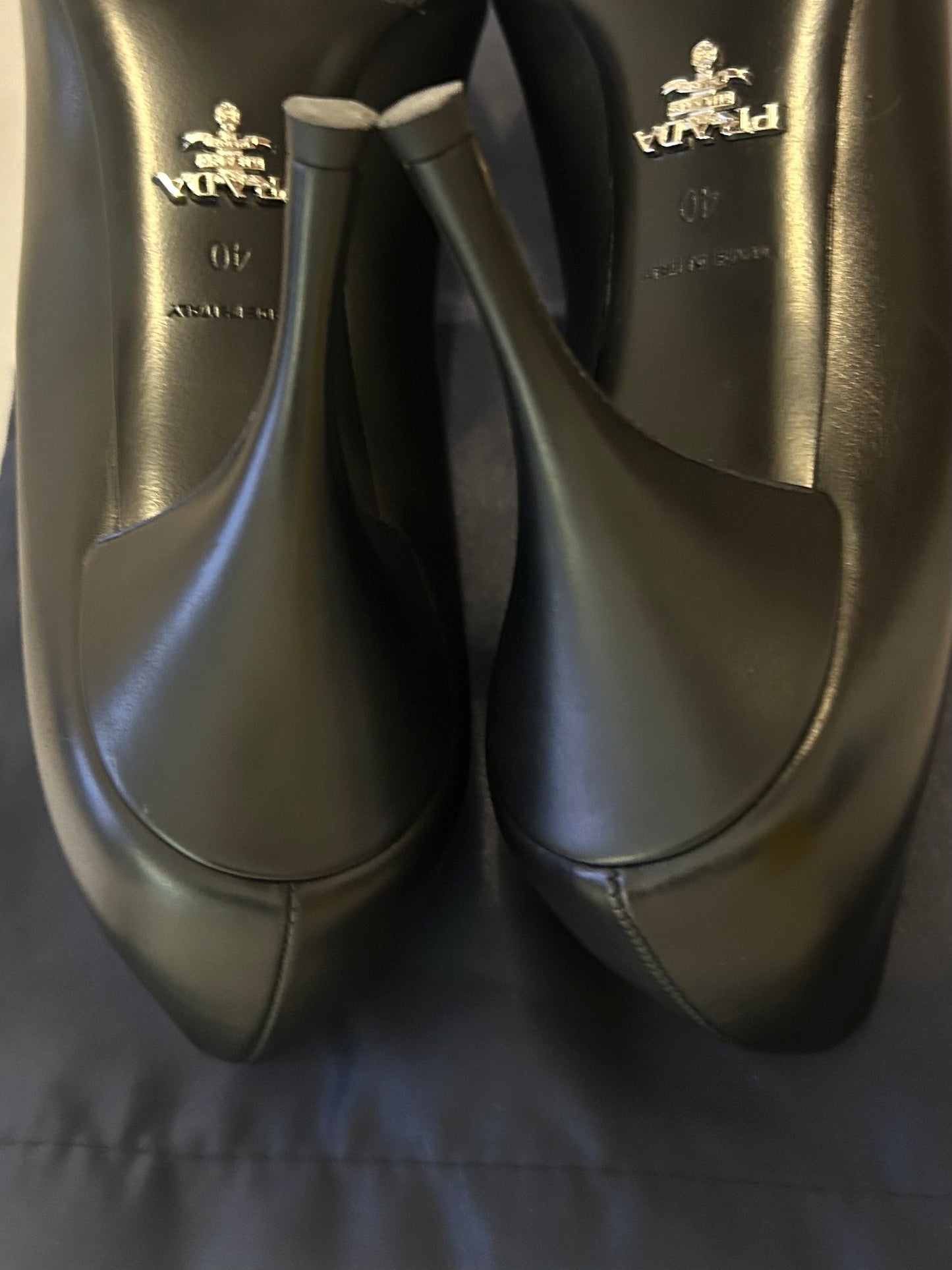 Black leather stiletto pumps